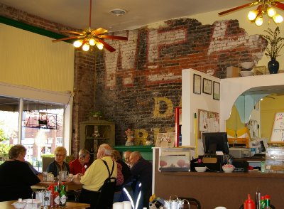 A conversation corner complete with revealed original brick wall painting in Puyallup, Washington.