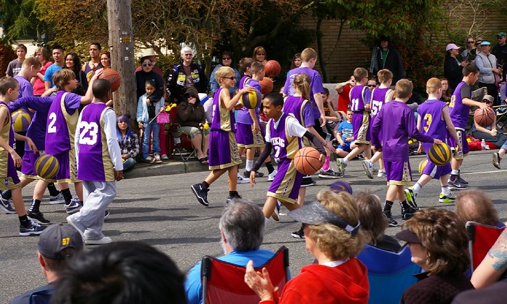 The Puyallup High School basket ball camp participants in the Daffodil Floral Parade in Puyallup, Washington.