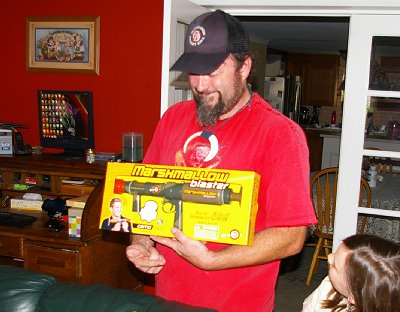 Del looking at his new marshmallow gun in Parkland, Washington.